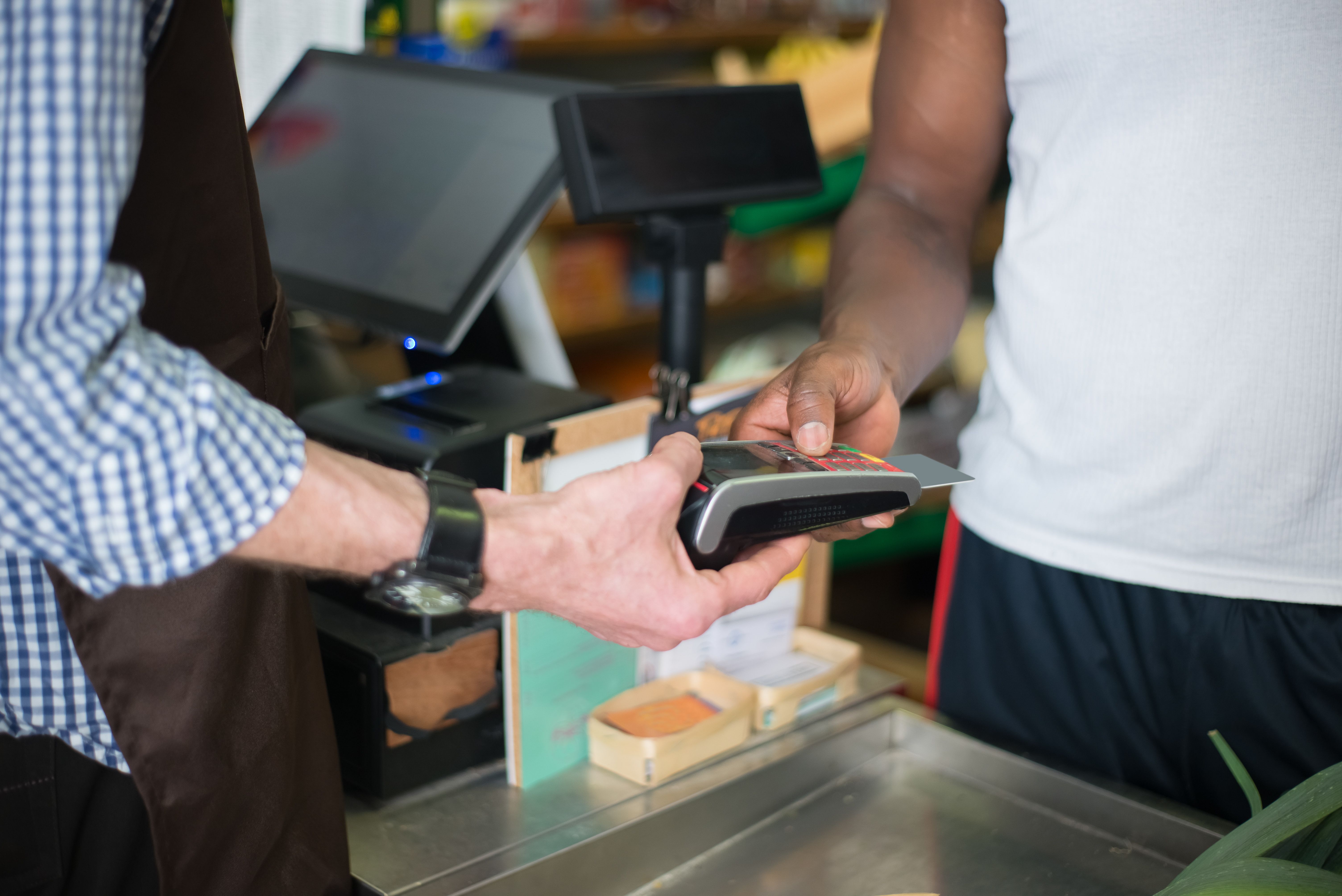 Paying by card at a cafe, with the purchase reflected in your cash flow table